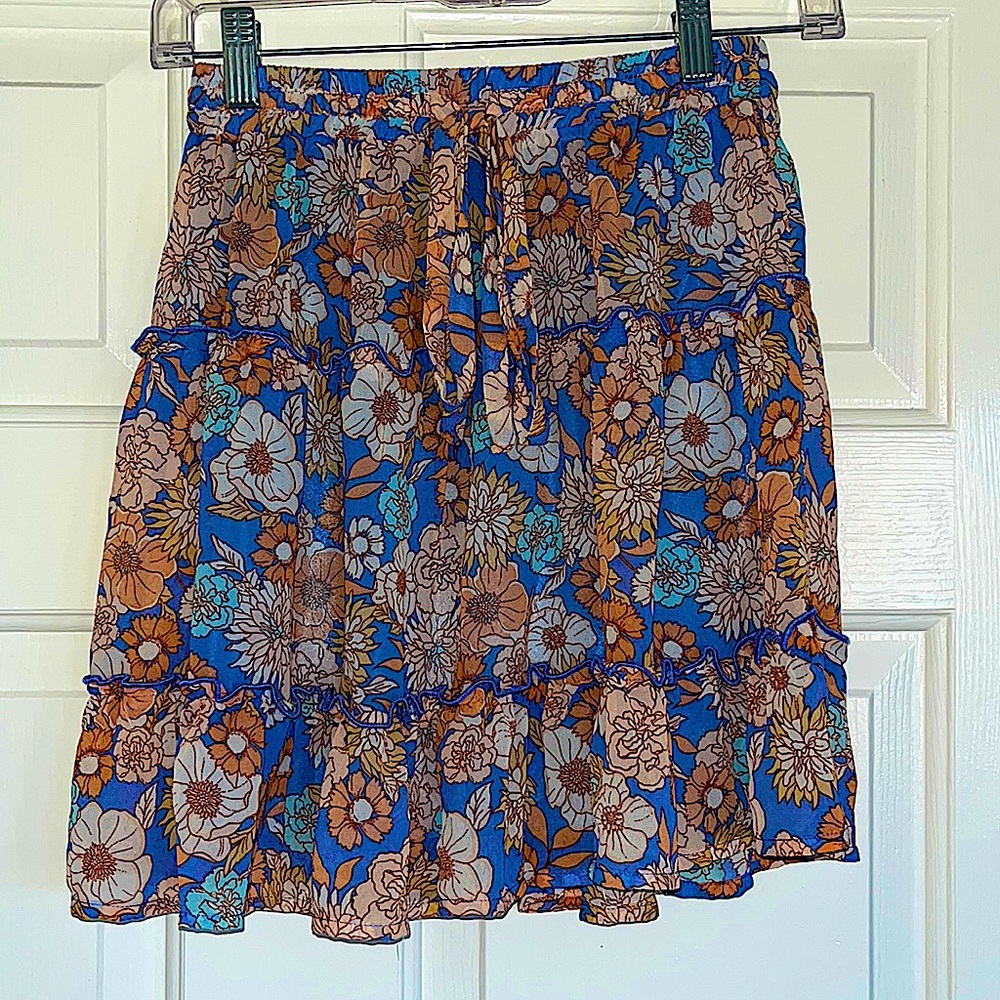 Lightweight skirt, floral print, periwinkle, orange, and tan.
